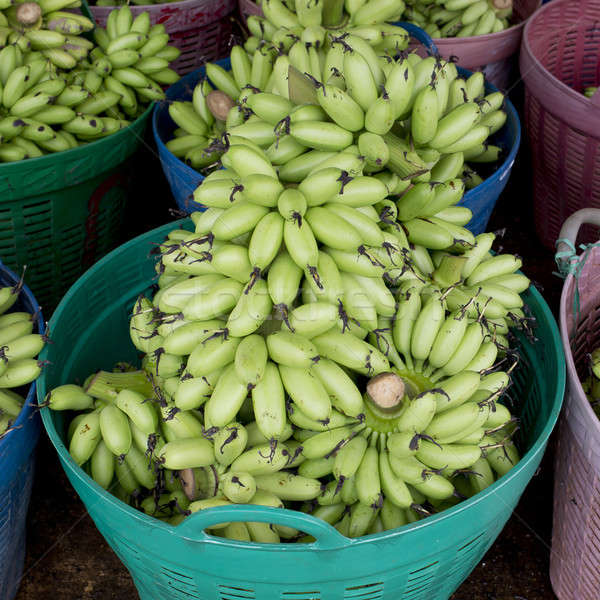 Green banana bundle in basket ready to sell Stock photo © art9858