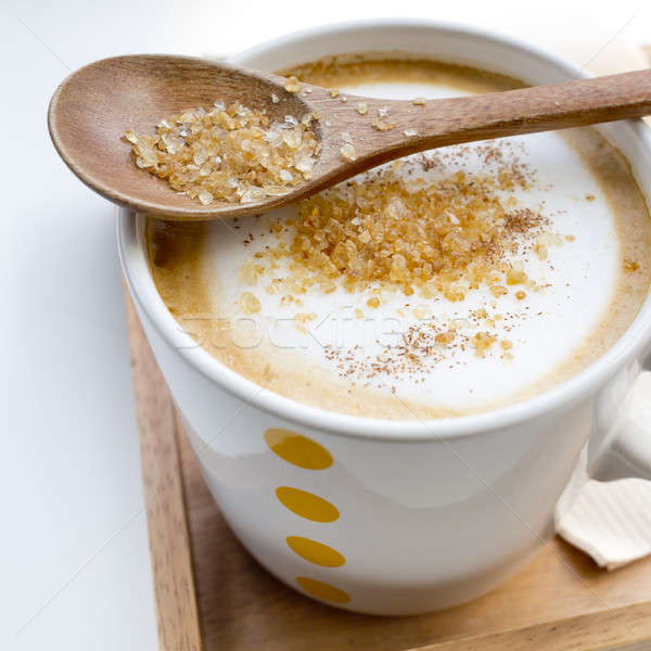 Brown sugar on a spoon and a cup of coffee Cappuccino Stock photo © art9858