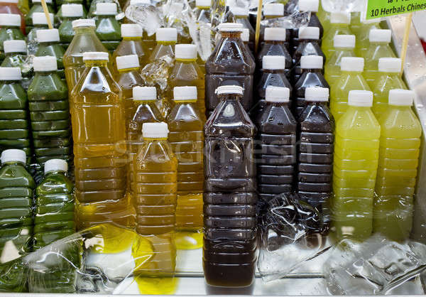Válogatás hideg trópusi gyümölcs dzsúz üvegek zöld Stock fotó © art9858