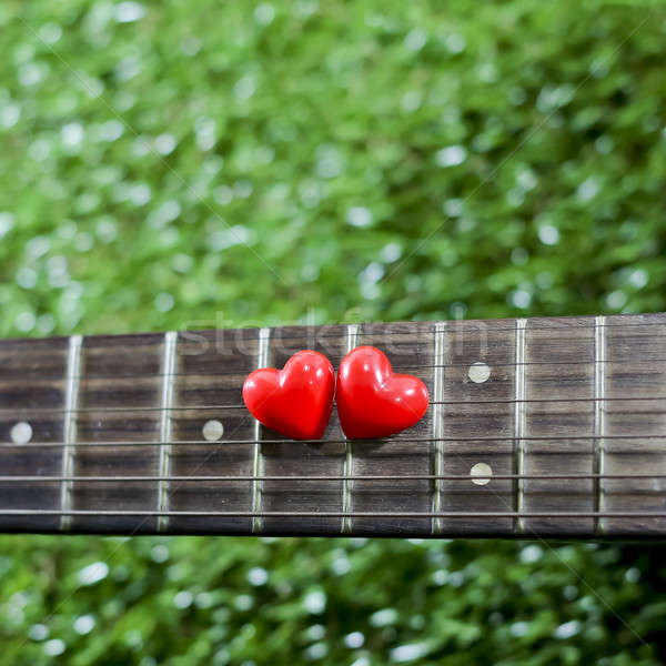 heart on neck guitars and strings on the grass Stock photo © art9858