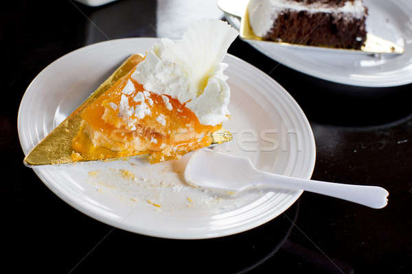 Stock photo: Half Eaten Slice of Orange Cake