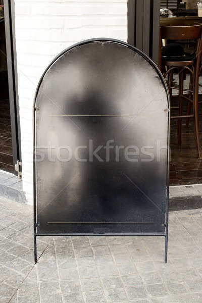 Blank black iron menu board with clipping path front of cafe Stock photo © art9858