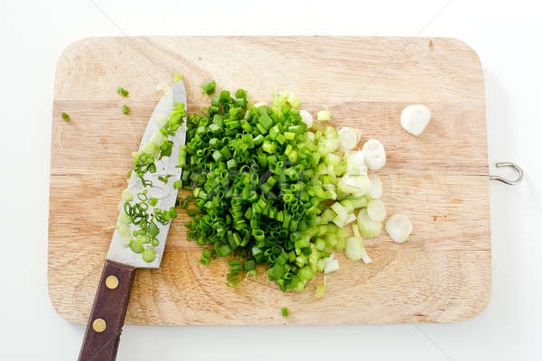 Spring onion on a cutting board with knife Stock photo © art9858