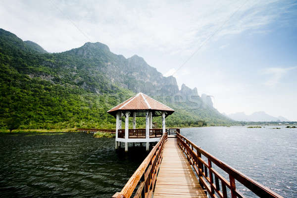 The wooden bridge in lotus lake and wood waterfront pavilion, at Stock photo © art9858