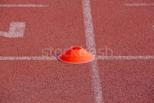 Orange marker in running track for the athletes background Stock photo © art9858
