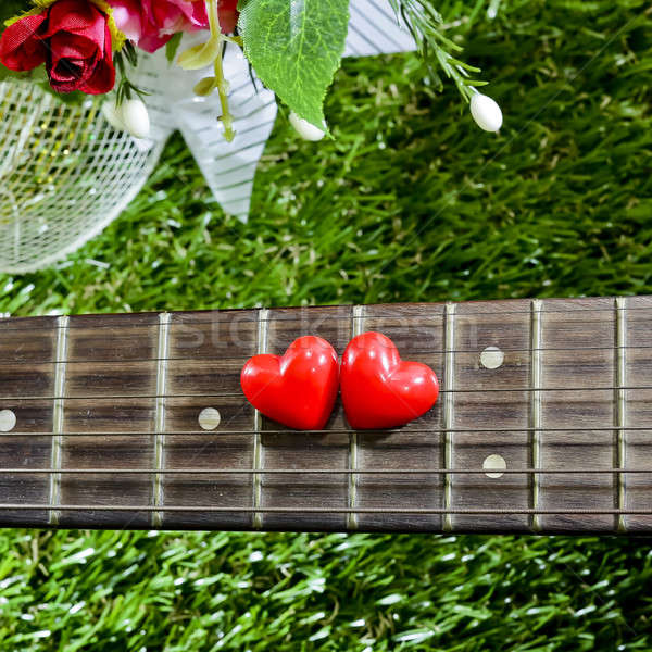 heart on neck guitars and strings on the grass Stock photo © art9858