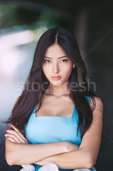 Young serious angry woman portrait outdoors Stock photo © artfotodima
