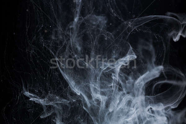 Acrylic colors and ink in water. Abstract background Stock photo © artfotodima