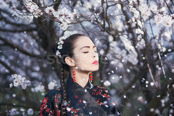 Asian woman meditating in garden Stock photo © artfotodima