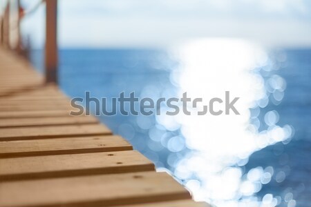 Blue sea and wooden pier Stock photo © artfotodima