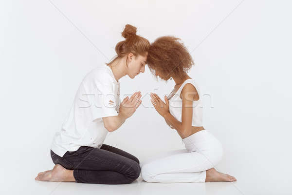 Young couple in yoga pose Stock photo © artfotodima