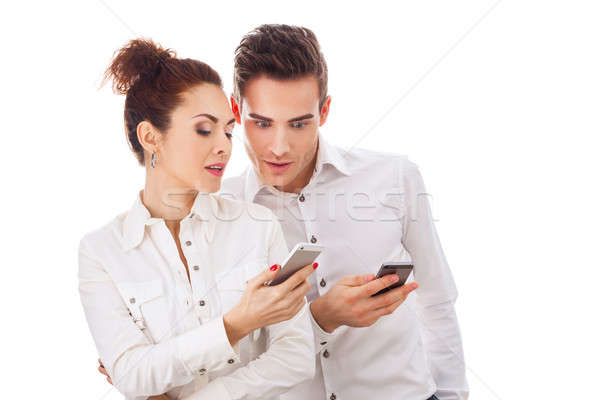çift telefonlar kız erkek yalıtılmış beyaz Stok fotoğraf © artfotodima