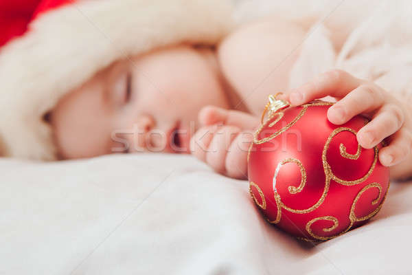 Small boy sleeping in a New Year's cap, focus on hand Stock photo © artfotodima