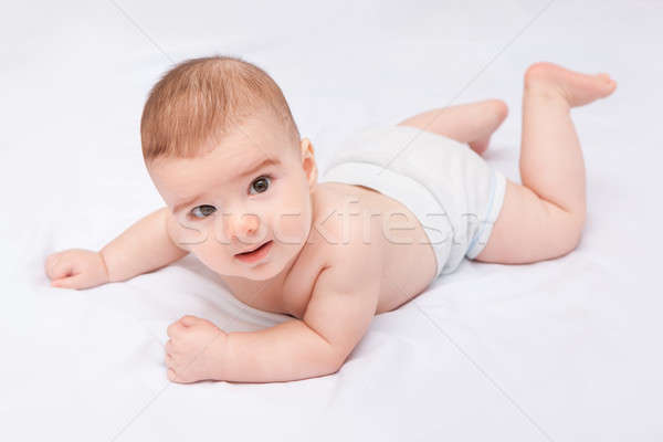 Stock photo: Cute smiling baby boy on white background