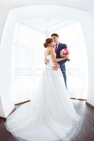 Bride and groom in very bright room at home Stock photo © artfotodima