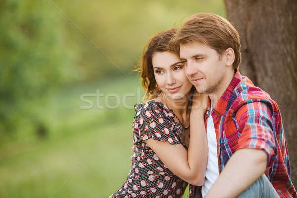 Affectueux couple prairie heureux séance vert Photo stock © artfotodima