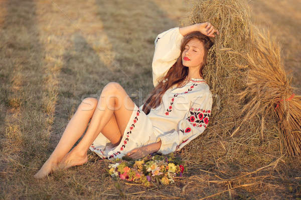 Stock photo: Beautiful girl in meadow in national suite