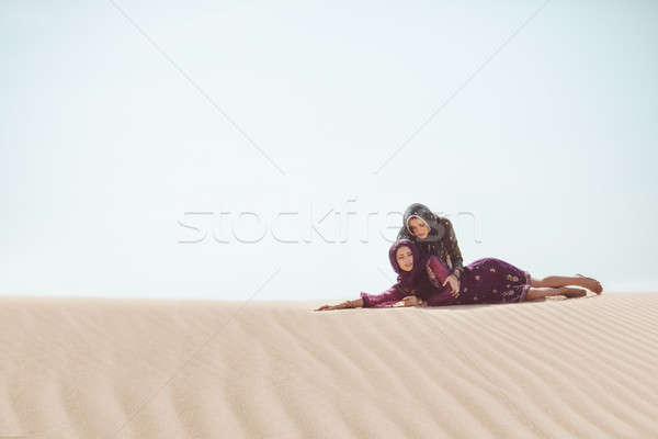 Women thirsty in a desert. Unforeseen circumstances during the travel. Stock photo © artfotodima