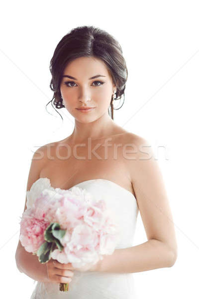 Beautiful brunette woman as bride with pink wedding bouquet on white Stock photo © artfotodima