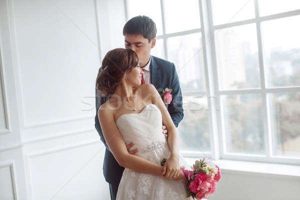 Bride and groom in very bright room Stock photo © artfotodima