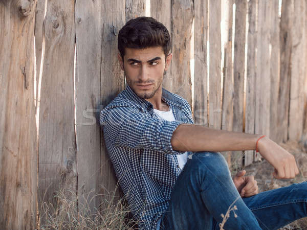 Przystojny młody człowiek odkryty portret zarost posiedzenia Zdjęcia stock © artfotodima