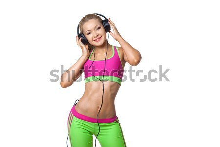 Smiling young woman with headphones isolated on white background Stock photo © artfotodima