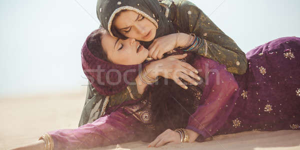 Women thirsty in a desert. Unforeseen circumstances during the travel. Stock photo © artfotodima