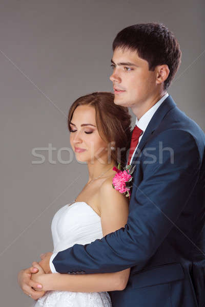 Loving couple standing in the studio Stock photo © artfotodima
