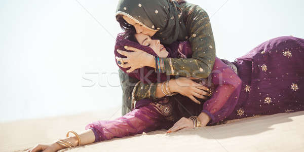 Women thirsty in a desert. Unforeseen circumstances during the travel. Stock photo © artfotodima