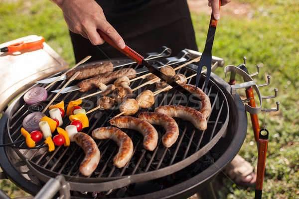 Stock photo: Fresh meat and vegetables on outdoor grill 