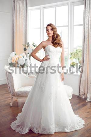 The Bride. Young women with wedding dress in very bright room,  Stock photo © artfotodima