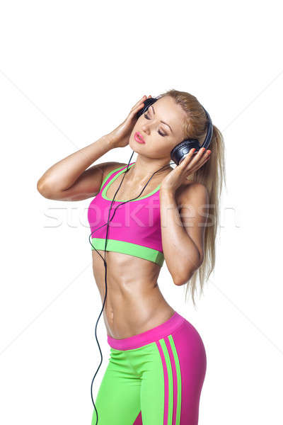 Smiling young woman with headphones isolated on white background Stock photo © artfotodima