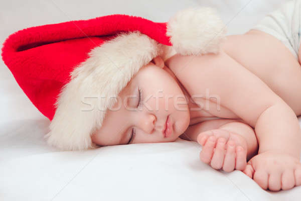 Small boy sleeping in a New Year's cap Stock photo © artfotodima