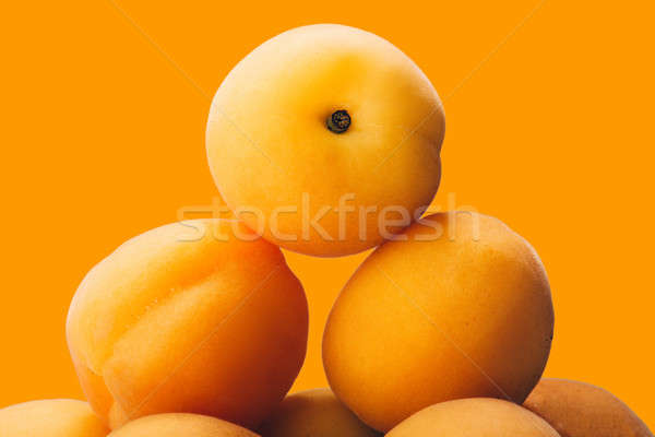 yellow peach slices on plate isolated on yellow Stock photo © artfotoss