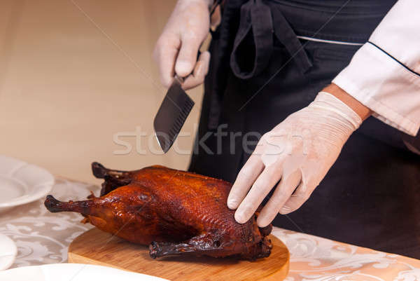 cooking roast duck in restaurant Stock photo © artfotoss