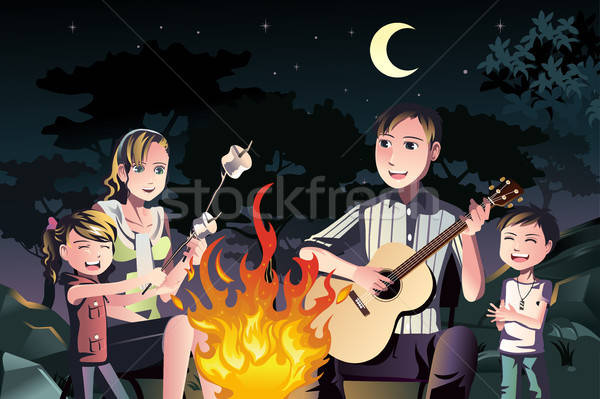 Famille feu de joie famille heureuse extérieur fille feu [[stock_photo]] © artisticco