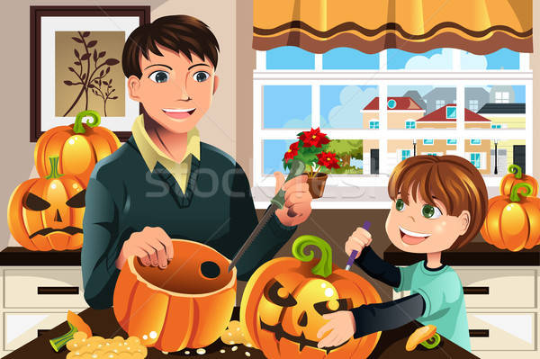 Father and son carving pumpkins Stock photo © artisticco