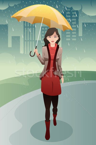 女子 步行 雨 傘 商業照片 © artisticco