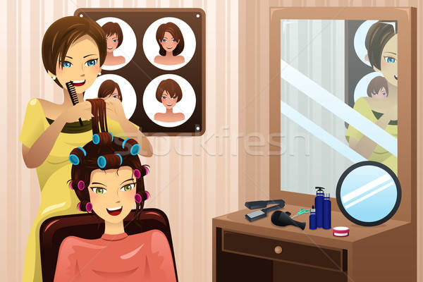 Hairstylist working in a salon Stock photo © artisticco