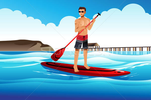 Man paddle boarding in the ocean Stock photo © artisticco