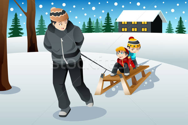 Father pulling his sons riding on a sled Stock photo © artisticco