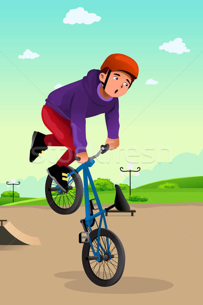 Boy doing a bike stunt Stock photo © artisticco