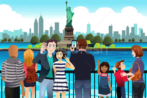 Tourists Taking Picture Near Statue of Liberty Stock photo © artisticco