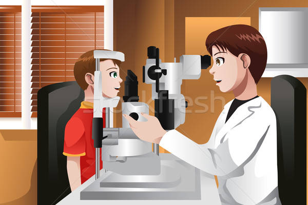 Boy having his eyes checked at the doctor office Stock photo © artisticco