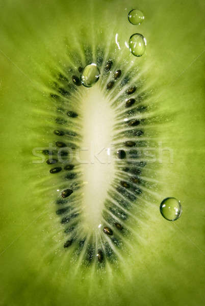 Macro of kiwi with water drops background Stock photo © artjazz
