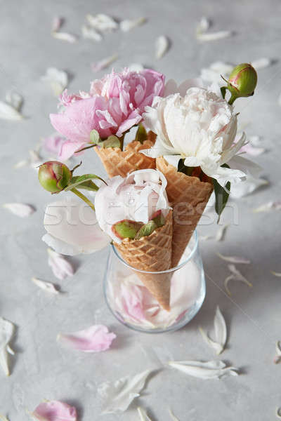 Greeting card with three sweet wafer cones and gentle peony flow Stock photo © artjazz