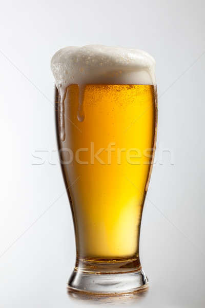 Cerveza vidrio aislado blanco luz bar Foto stock © artjazz
