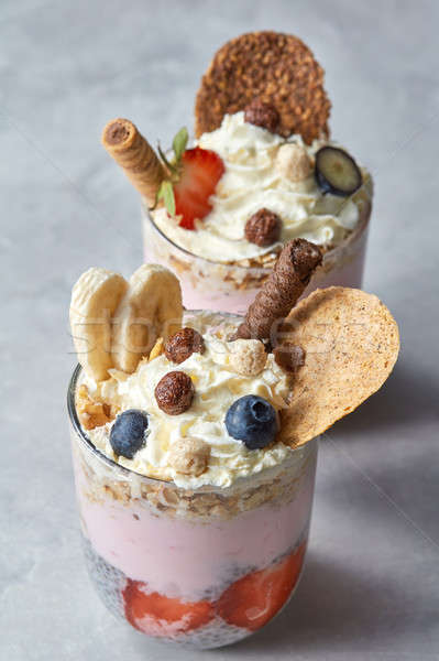 yogurt with muesli and berries on a concrete background Stock photo © artjazz