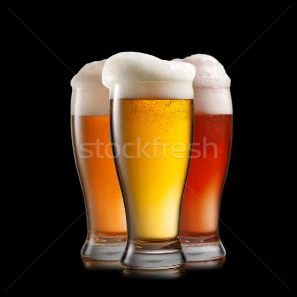 Different beer in glasses isolated on black background Stock photo © artjazz