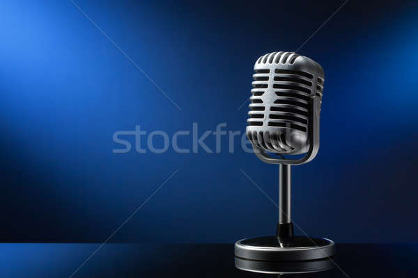 Retro microphone on blue Stock photo © artjazz